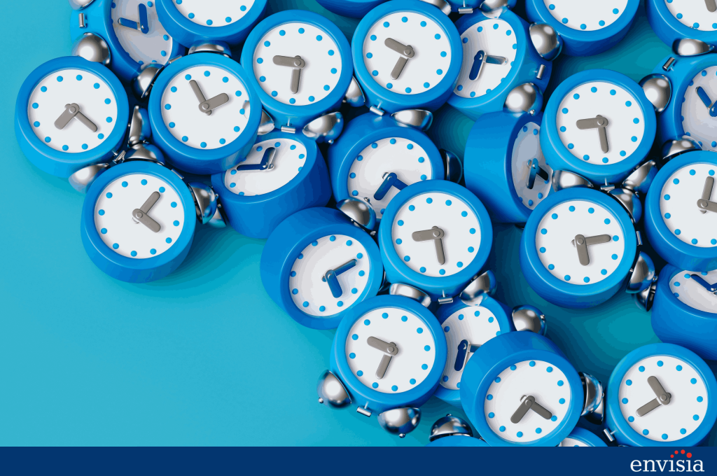 Pile of blue alarm clocks symbolising the timing and scheduling needs of 360 degree feedback surveys